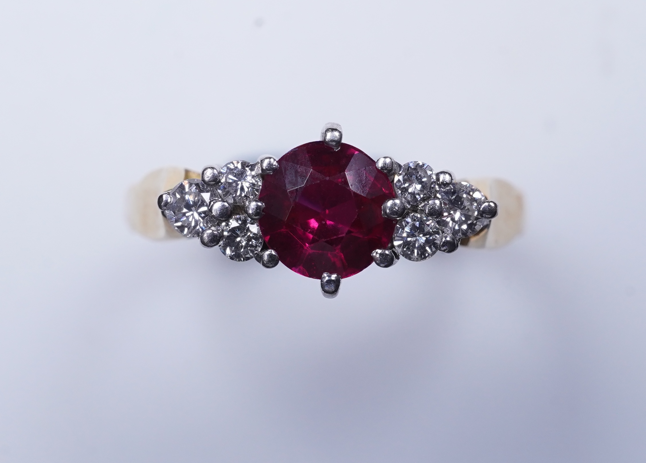 A synthetic ruby and diamond ring